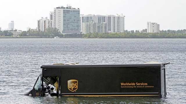 A UPS truck ended up in Biscayne Bay this week. The driver is OK. (Photo courtesy Walter Michot/Miami Herald)