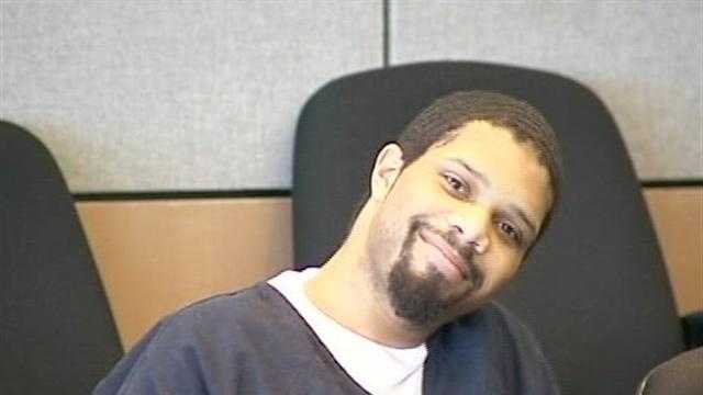 Reginald Johnson Jr. smiles at the camera in court on the day he was sentenced to 45 years in prison for killing Laronda Becker.