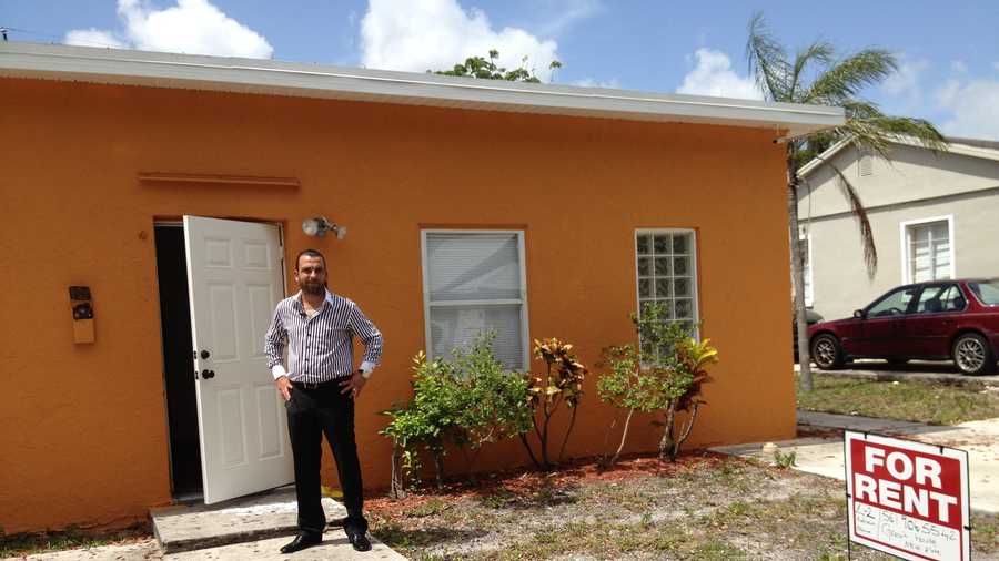 Erdem Altinok, who owns 22 rental units, stands outside his newly renovated property north of downtown West Palm Beach.