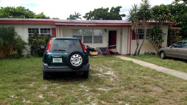 A woman returning to her home in Lake Worth on Thursday crashed into a man holding a baby. (Ted White/WPBF)
