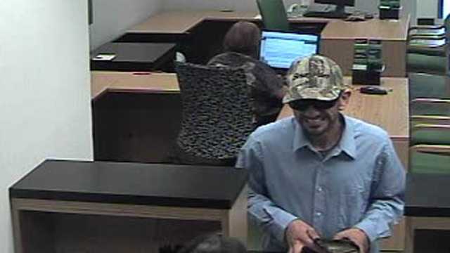 Detectives are trying to identify this man who robbed a TD Bank branch in Wellington.