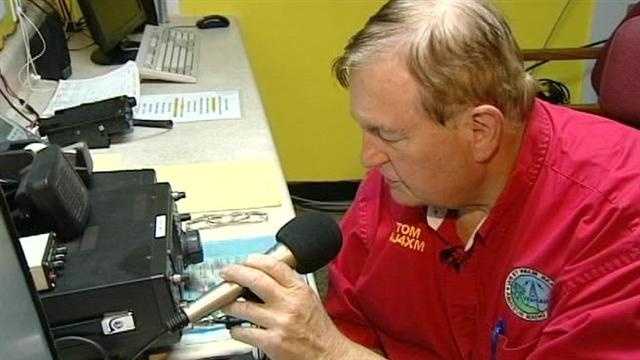 Ham radio operators monitor radio traffic at sea as Tropical Storm Isaac inches its way closer to South Florida.