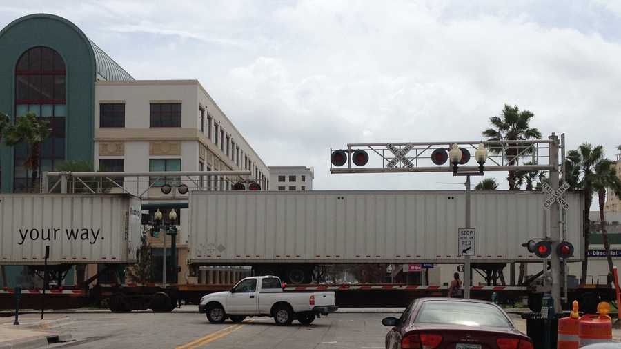 A freight train was stopped on the railroad tracks in downtown West Palm Beach, blocking traffic near the intersection of Clematis Street and Quadrille Street.