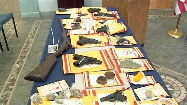 Authorities confiscated 20 guns and seized more than $15,000 worth of marijuana, cocaine and prescription drugs.