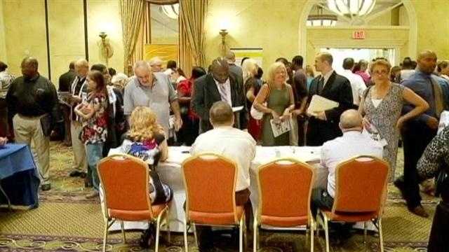 More than 2000 people show up for a job fair at the Marriott in West Palm Beach, where 31 companies have more than 700 jobs up for grabs.