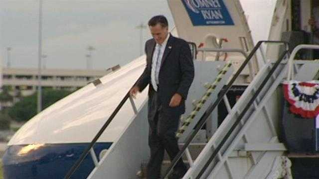 Mitt Romney steps off his plane after arriving at Palm Beach International Airport.