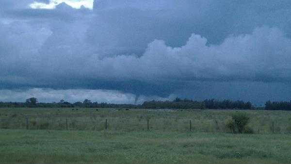 Viewers capture photos of a funnel cloud near Indiantown.