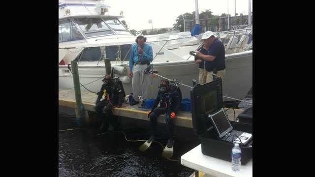 Sheriff's office divers on Nov. 14 search for the body of a man who was found near his house boat at Club Med.