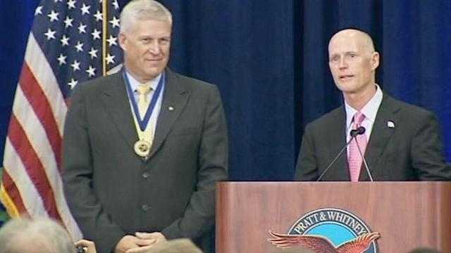 Gov. Rick Scott (right) and Louis Chênevert, chairman and CEO of United Technologies Corp., announce that Pratt & Whitney is expanding its operations in Jupiter.
