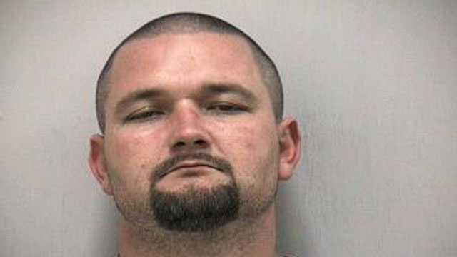 Stephen Bates was arrested after deputies said he threatened his neighbor with a chain saw.