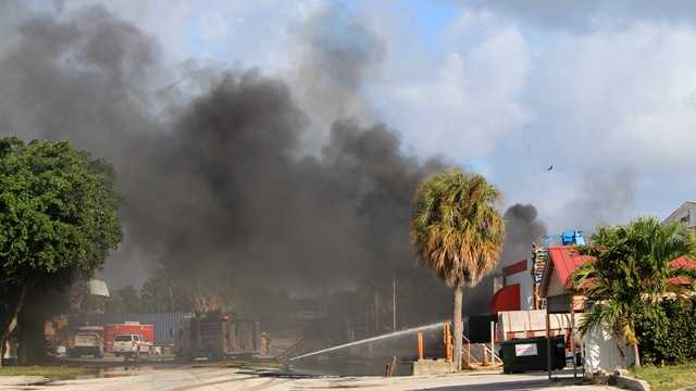 Fire ripped through a West Palm Beach tire store late on the evening of Dec. 1. (Photo: John P. Wise/WPBF)