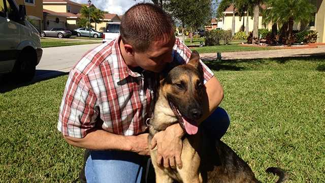 FHP Trooper Bobby Boody meets his new dog, Tony, after Drake died following a violent break-in at Boody's home last month.