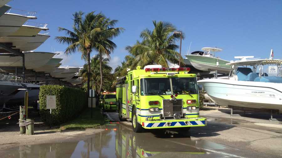 Firefighters are trying to determine what caused a small boat to explode at the PGA Marina.