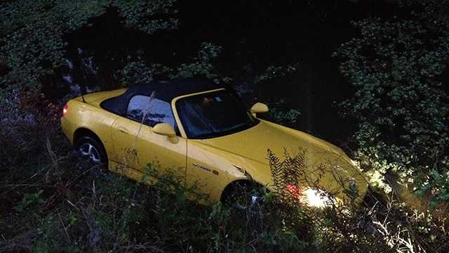 This car ended up in a canal in Wellington early Thursday morning, but the driver is OK. (Photo: Chris McGrath/WPBF)