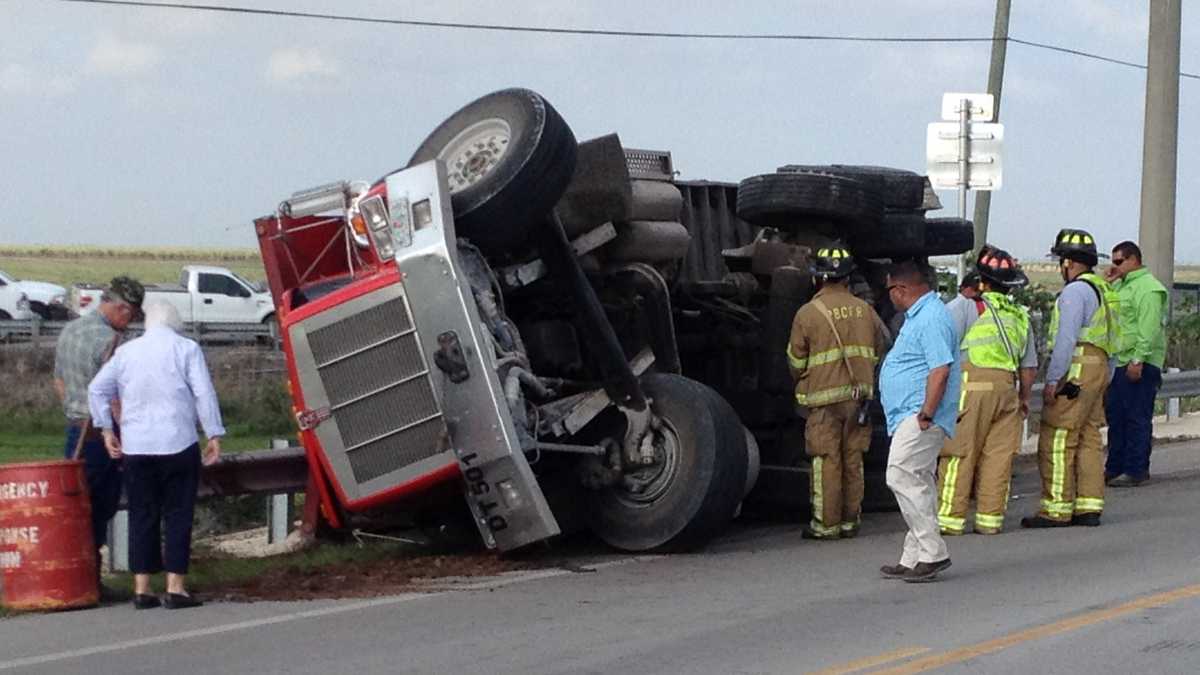 Sugar cane spills onto road after crash in Belle Glade