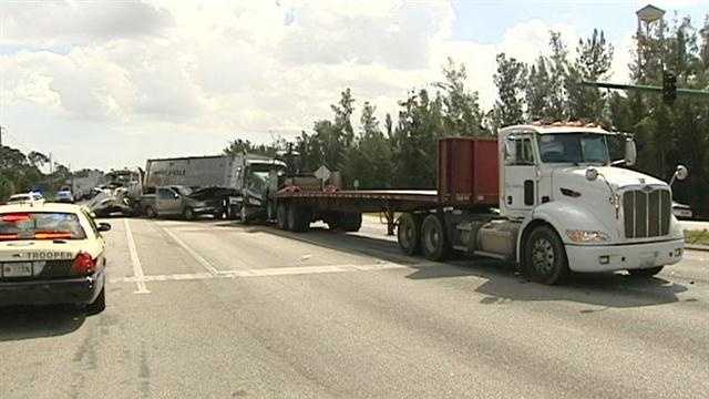 One person was killed in a massive crash involving three tractor-trailers on Beeline Highway.