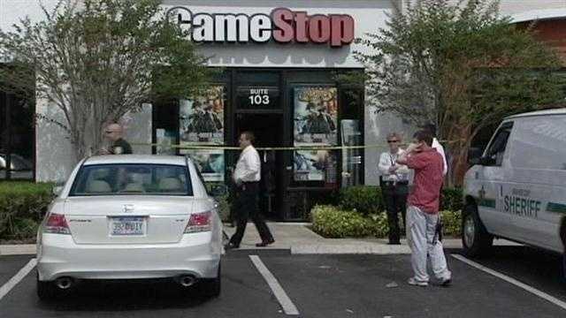 Detectives say two gunmen tied up an employee during a robbery at a Game Stop in Vero Beach.