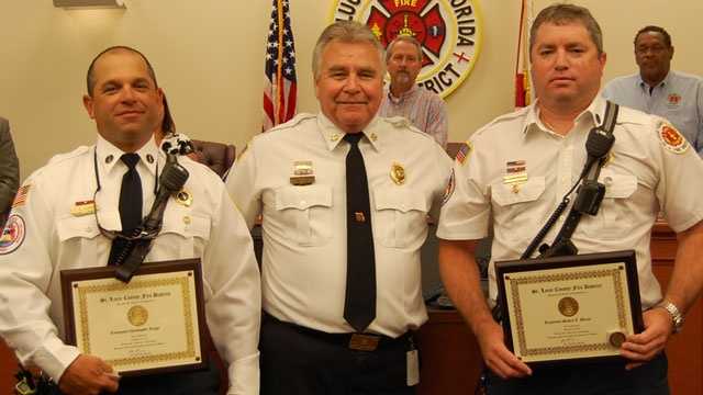 2 firefighters honored for saving boy from burning home