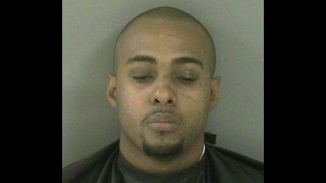 Omar Outten was arrested on gun and drug charges after detectives executed a search warrant at his Vero Beach home.