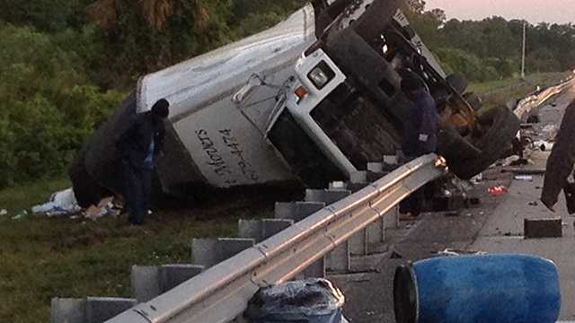 No one was injured when this tractor-trailer rolled over a guardrail on Florida's Turnpike during the Wednesday morning commute near the Martin County/Palm Beach County line.