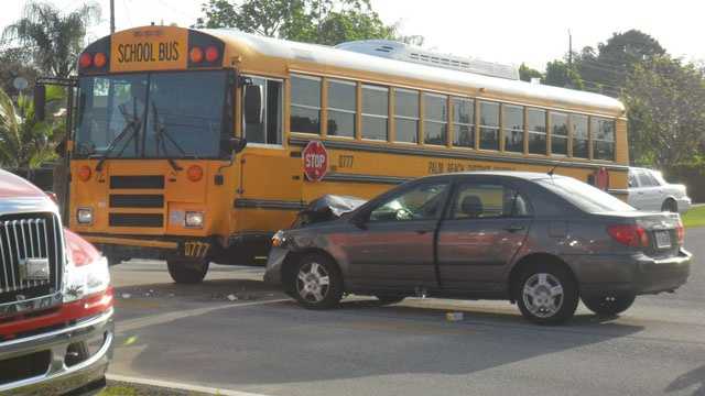 No students were injured when this school bus and car collided.