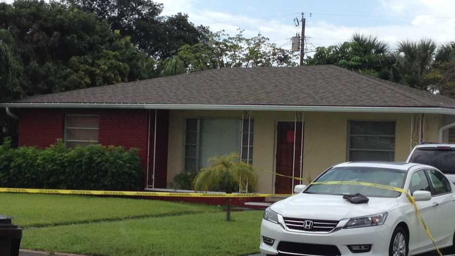 Police and DEA agents are seen going in and out of a West Palm Beach home where a man was severely burned.