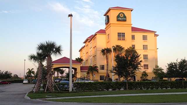 Two armed men got away after a security guard shot at them at this La Quinta Inn hotel in Fort Pierce early Tuesday morning.