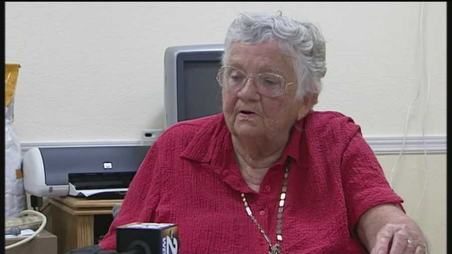 A 79-year-old woman said the man who carjacked her while she was taking out the trash Friday morning was well dressed.