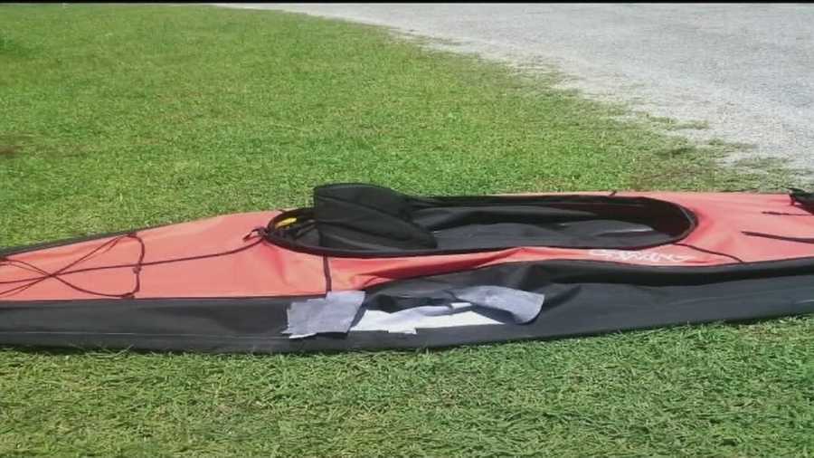 A woman calls 911 after her inflatable kayak was attacked by an alligator.