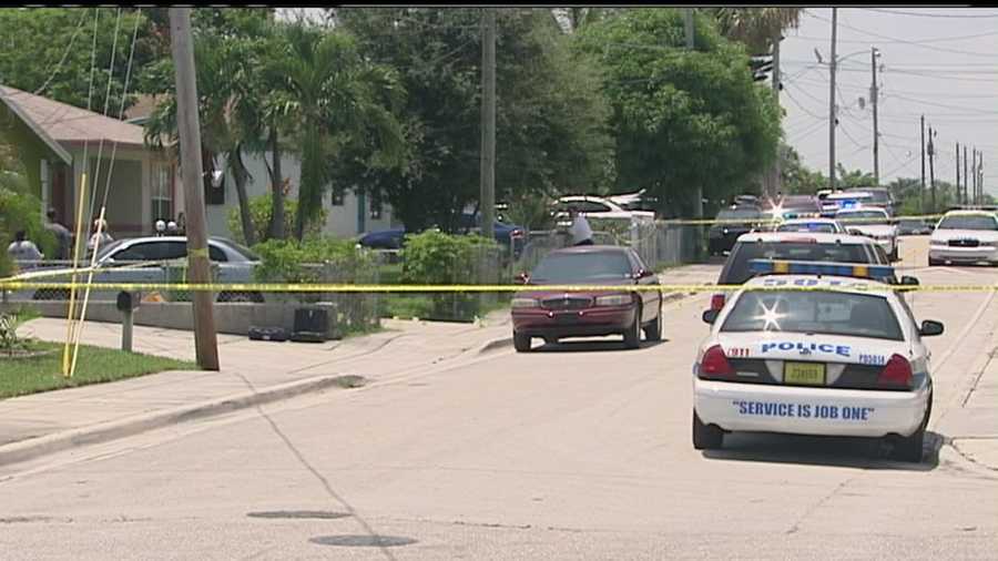 A woman explains how she dropped to the floor and started to pray after someone opened fire at her Riviera Beach home.