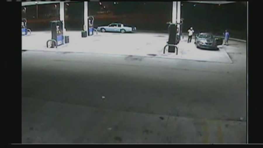 Surveillance video shows two armed men carjacking a driver at a Boynton Beach gas station.