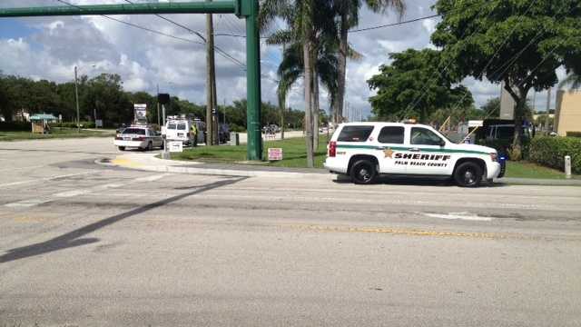 A father and child were struck by a van while crossing a Lake Worth road.