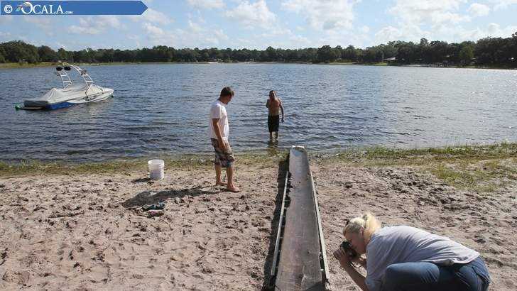 A 7-year-old boy and his grandfather found this canoe in an Ocala lake recently, and it's possible it might be several hundred years old. (Photo: Ocala Star-Banner)