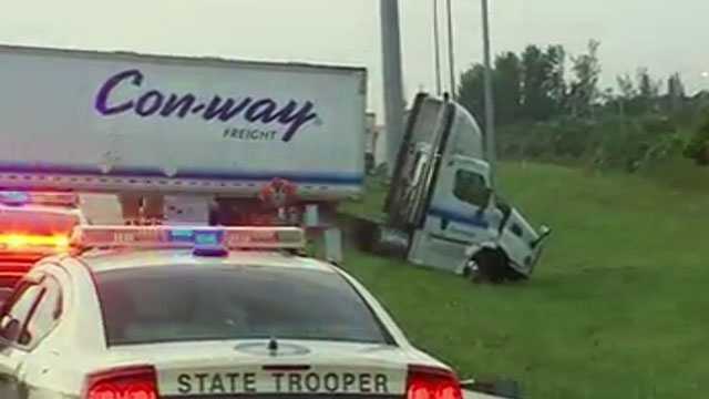 Traffic was backed up Tuesday morning after a car and a tractor-trailer collided on Florida's Turnpike near Royal Palm Beach.