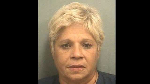 Carmen Baez is accused of taking a 14-year-old girl shoplifting at the Sears at the Boynton Beach Mall.