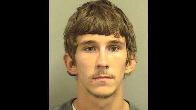 Corey Hardie is accused of killing an alligator and sending a picture of him kneeling over the carcass to his father.