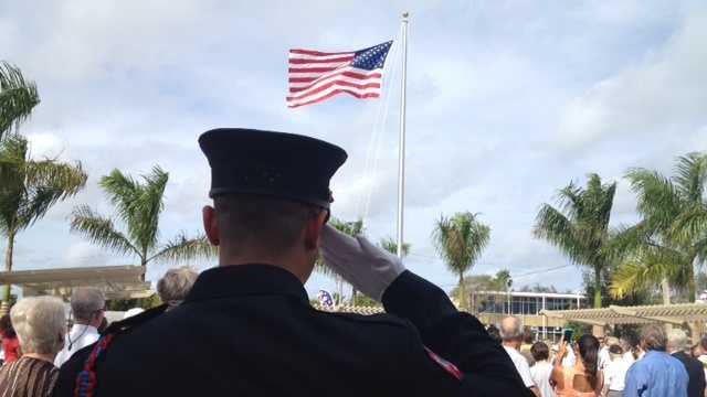 service member saluting the flag