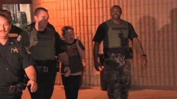 Kaitlyn Hunt leaves the Indian River County Jail surrounded by deputies early Friday morning.