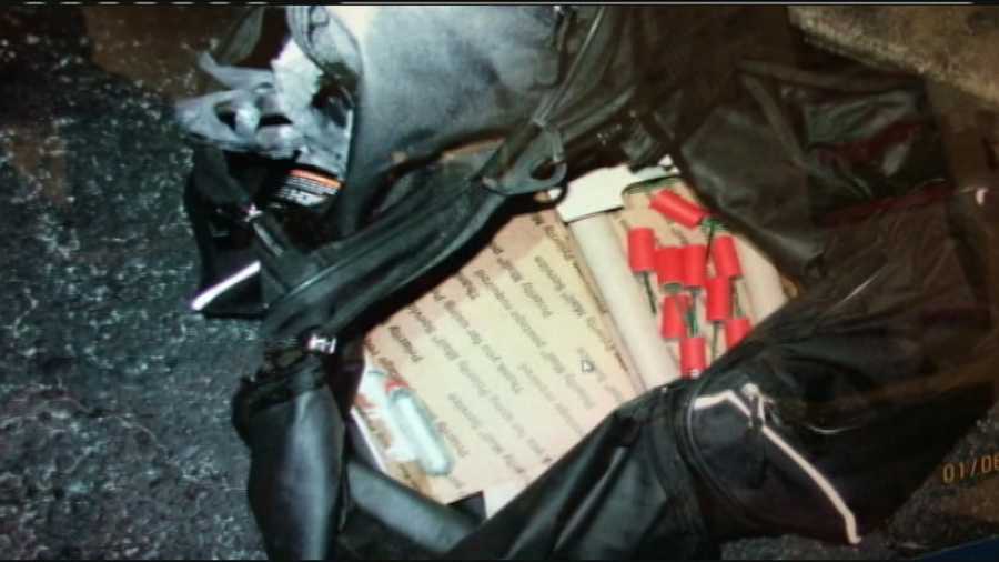 An Okeechobee police officer found explosives, guns and masks inside a car during a traffic stop on Monday.