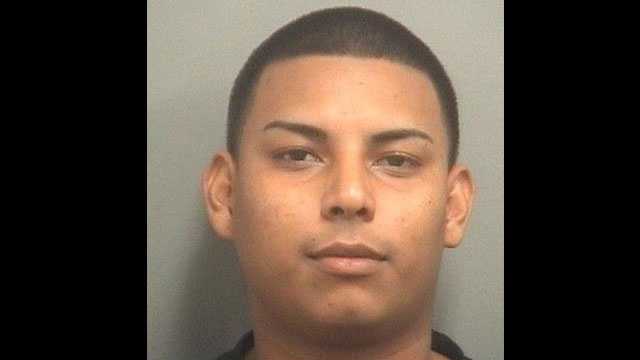 Edward Ulloa is accused of passing counterfeit $100 bills at the Mall at Wellington Green.