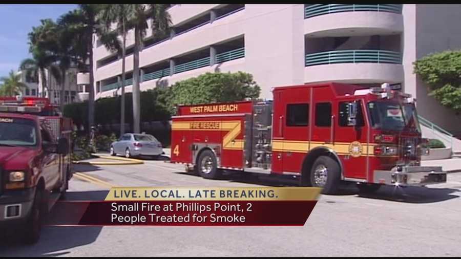 Firefighters responded to a fire inside the Phillips Point building in West Palm Beach on Thursday. Crews said the fire originated in the trash compactor in the parking garage.