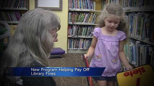 A program set to launch in June will allow kids to cut down their overdue-book fines by reading at the library.