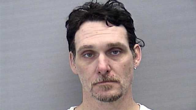 Hoyt Elie Adams was arrested after police say he dove through his neighbors' windows while under the influence of the drug "Molly."