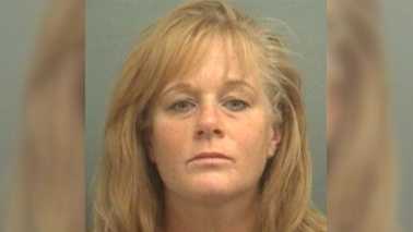 Pompano Beach firefighter Janeen McKenzie was arrested after Palm Beach County Sheriff's say she pointed a gun and fired at a man she met and brought home from a bar. McKenzie faces charges of aggravated battery with a firearm.