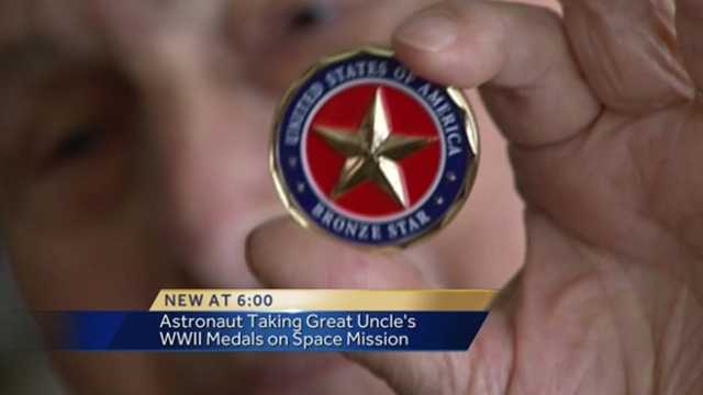 A rocket in Russia will take off to the International Space Station on Wednesday, and inside one astronaut's small box of possessions will be his great uncle's WWII Purple Heart and Bronze Star medals.