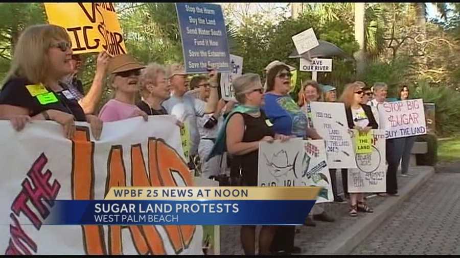 Dozens of people protested outside South Florida Water Management Headquarters, urging officials to back a plan allowing state lawmakers to buy thousands of acres of land south of Lake Okeechobee.