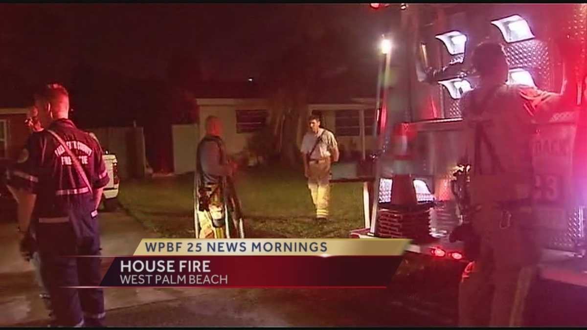 Crews battle house fire in West Palm Beach
