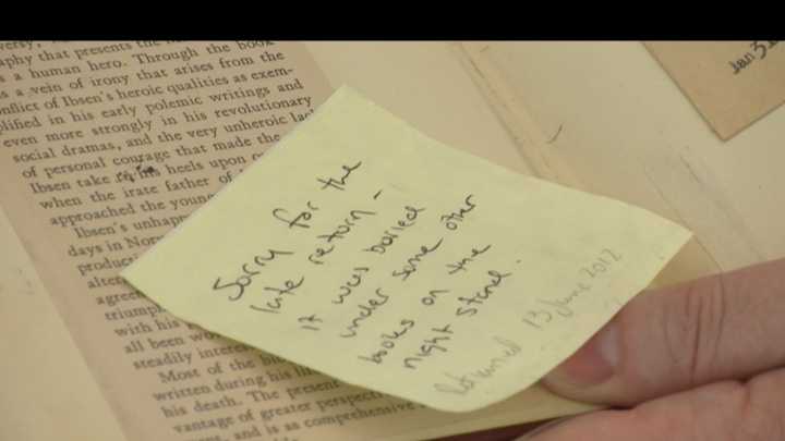 Someone returns a long-overdue book to a local library.