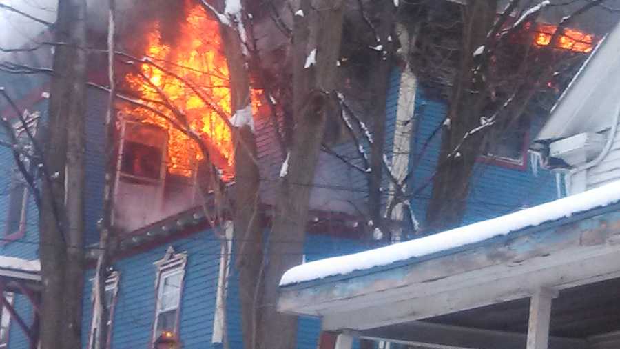 Fire at a four-apartment building on the corner of Main and Morton streets in Malone, New York.