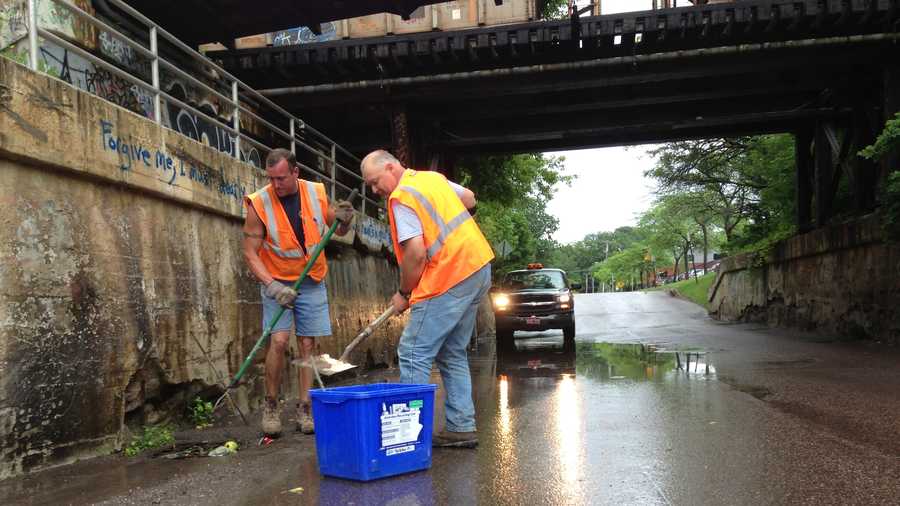 Burlington DPW employees clean batch basins of debris on Lakeside Avenue Friday, anticipating further weekend storms.